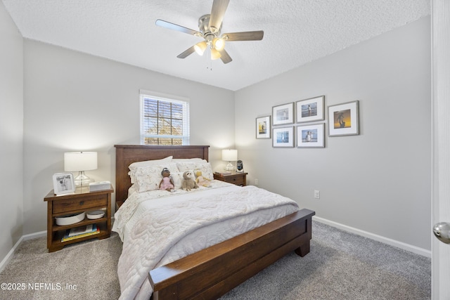 carpeted bedroom with ceiling fan and a textured ceiling