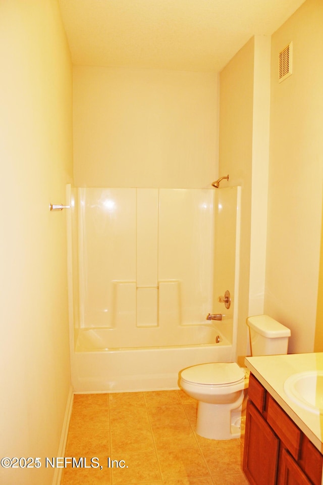 full bathroom featuring tile patterned flooring, vanity, tub / shower combination, and toilet