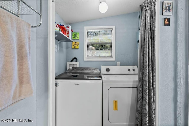 clothes washing area with independent washer and dryer