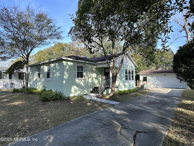 view of front of house featuring an outbuilding and a garage