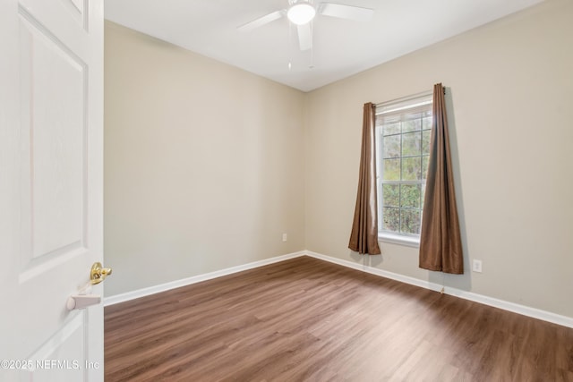 empty room with ceiling fan and hardwood / wood-style floors