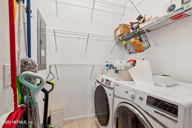 washroom featuring washer and dryer and light tile patterned floors