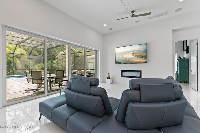 living room with light tile patterned floors and ceiling fan