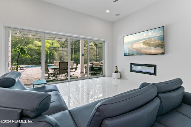 living room with plenty of natural light and tile patterned floors