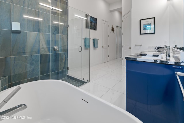 bathroom with vanity and independent shower and bath