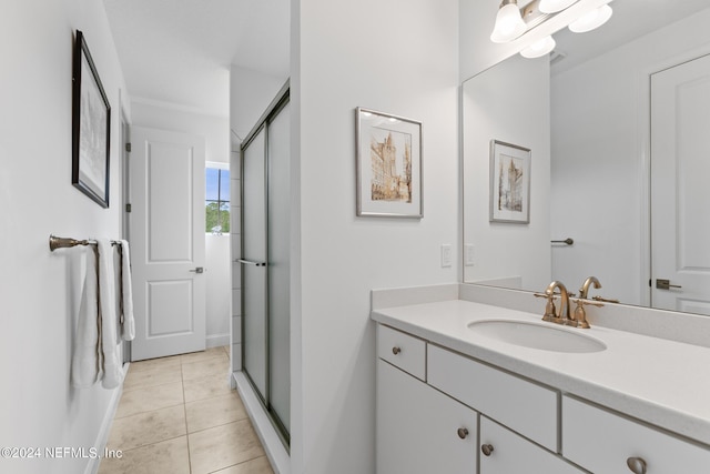 bathroom featuring vanity, an enclosed shower, and tile patterned floors