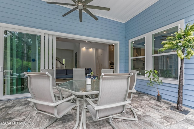 view of patio featuring ceiling fan