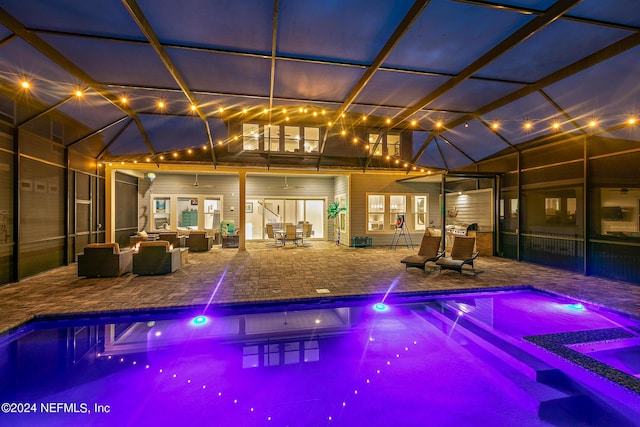 view of pool featuring a lanai, a patio area, and outdoor lounge area