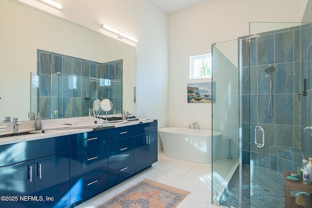 bathroom with vanity, tile patterned floors, and plus walk in shower