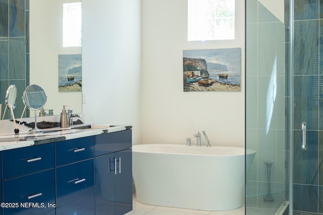 bathroom featuring vanity, tile patterned flooring, and shower with separate bathtub