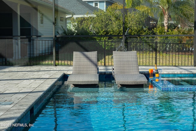 view of pool featuring an in ground hot tub