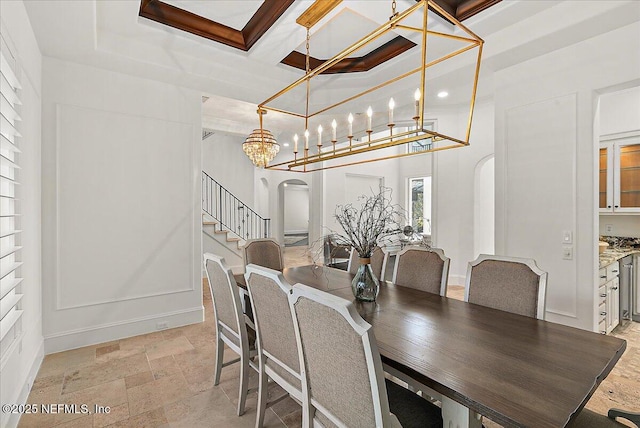 dining area with beamed ceiling and coffered ceiling