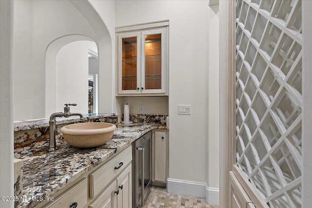 bathroom featuring vanity and beverage cooler