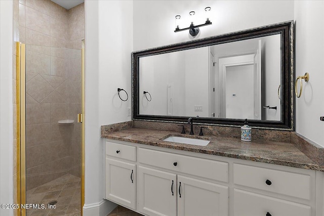 bathroom with vanity and an enclosed shower