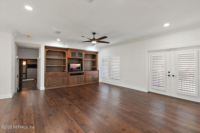 unfurnished living room with dark wood-type flooring and crown molding