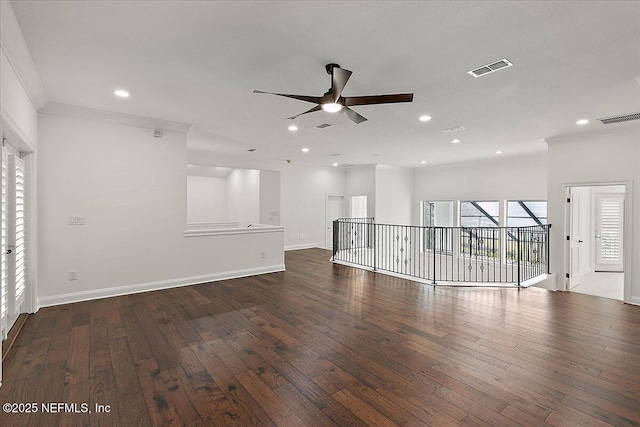 unfurnished living room featuring ornamental molding, dark hardwood / wood-style floors, and ceiling fan