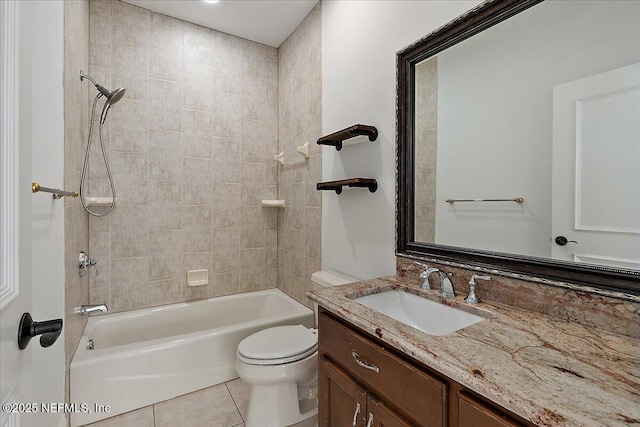 full bathroom with tiled shower / bath, vanity, toilet, and tile patterned flooring