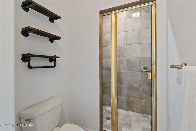 bathroom featuring an enclosed shower and toilet