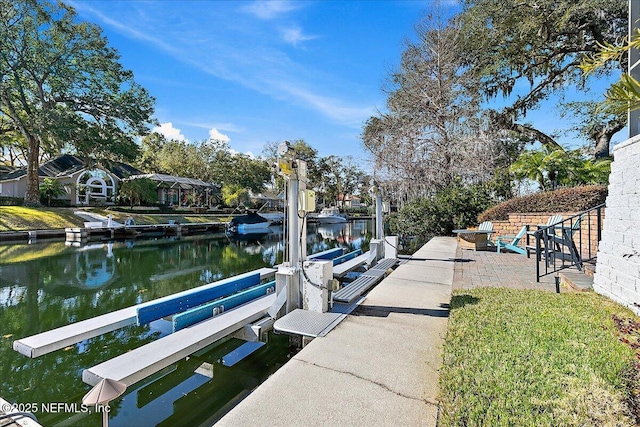 dock area with a patio and a water view