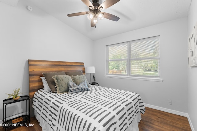 bedroom with lofted ceiling, dark wood-type flooring, and ceiling fan