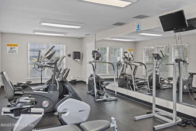 gym with a textured ceiling