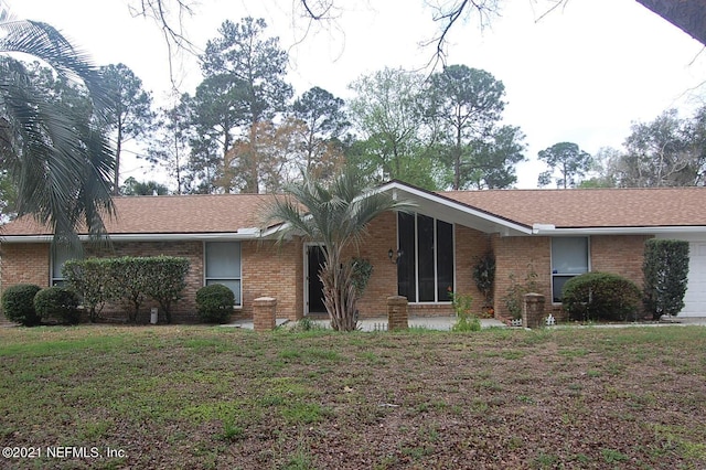 ranch-style house with a front yard