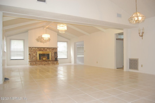 unfurnished living room with an inviting chandelier, a fireplace, beam ceiling, and a wealth of natural light