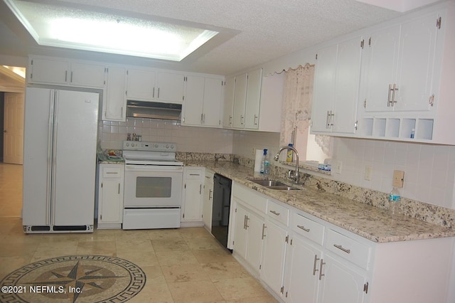 kitchen featuring sink, white cabinetry, a textured ceiling, white appliances, and decorative backsplash