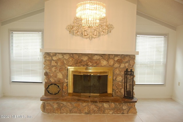 details featuring a notable chandelier and a stone fireplace