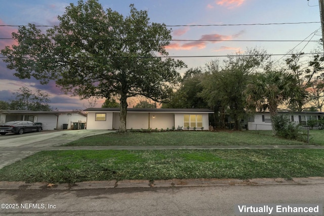 view of front of home with a lawn