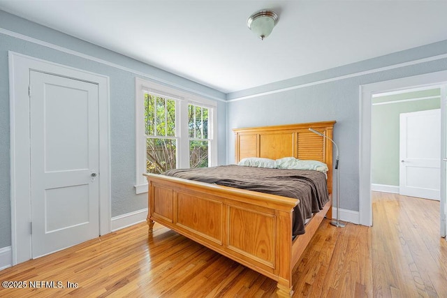 bedroom with light wood-type flooring