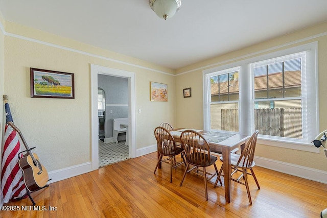 dining area with light hardwood / wood-style floors