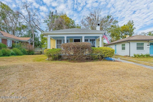 view of front of home with a front yard