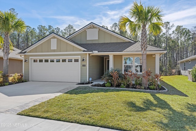 view of front of home with a garage and a front lawn