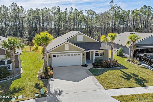 view of front of property with a garage and a front lawn