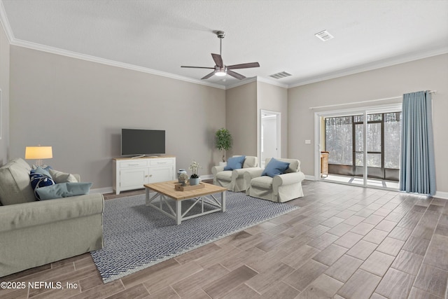 living room featuring ornamental molding and ceiling fan