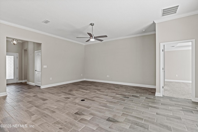 empty room featuring ornamental molding and ceiling fan