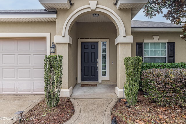 doorway to property featuring a garage