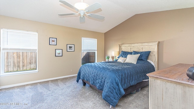 bedroom with carpet, vaulted ceiling, baseboards, and ceiling fan