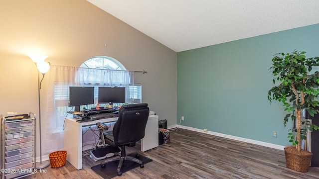 home office with baseboards, vaulted ceiling, and wood finished floors