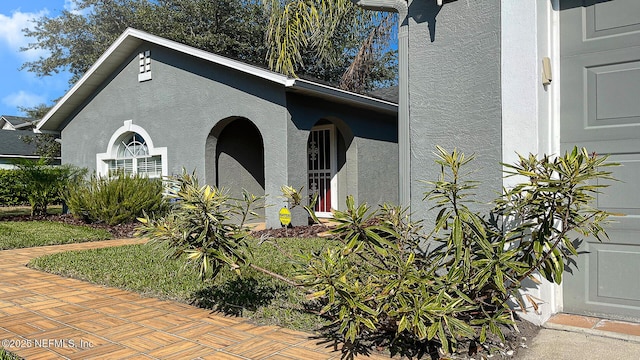 exterior space featuring stucco siding