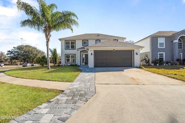 view of front of home with a garage and a front yard