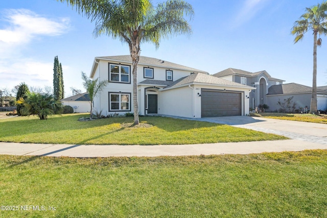 view of front of property with a garage and a front yard