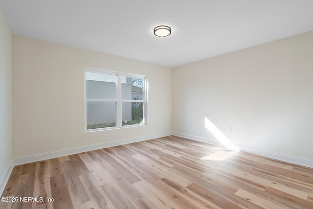 unfurnished room featuring light hardwood / wood-style flooring