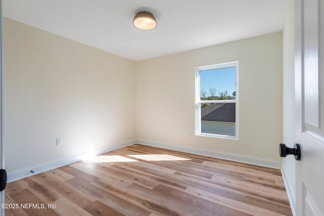 empty room with light wood-type flooring