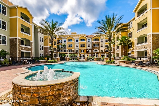 view of swimming pool featuring pool water feature