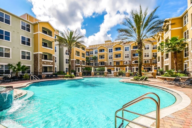 view of swimming pool featuring a patio area