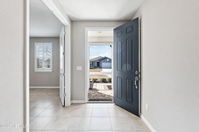 entrance foyer featuring a wealth of natural light and light tile patterned floors