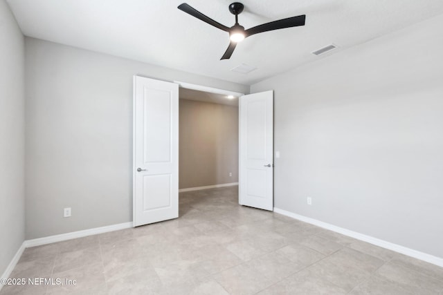 unfurnished bedroom featuring ceiling fan