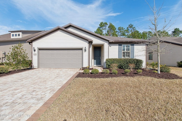 single story home with a garage and a front yard